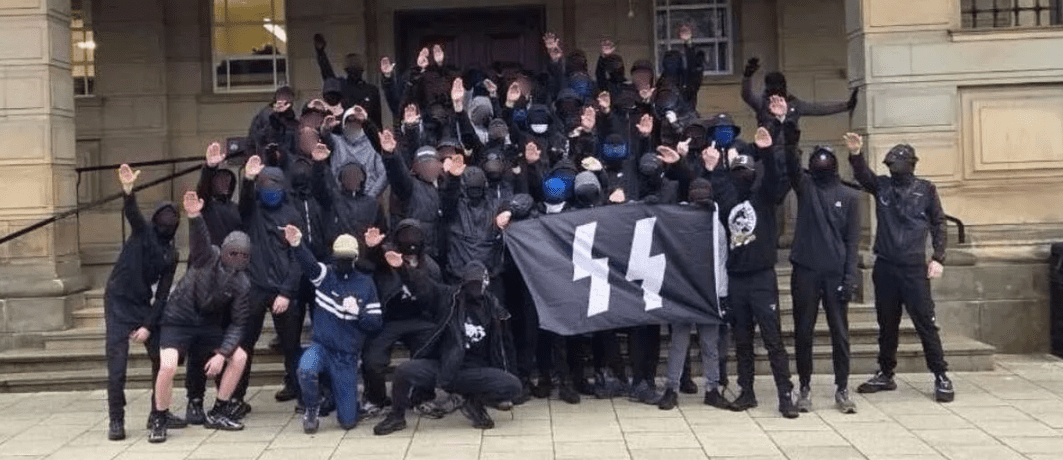 Football club condemns nazi salutes and SS banner